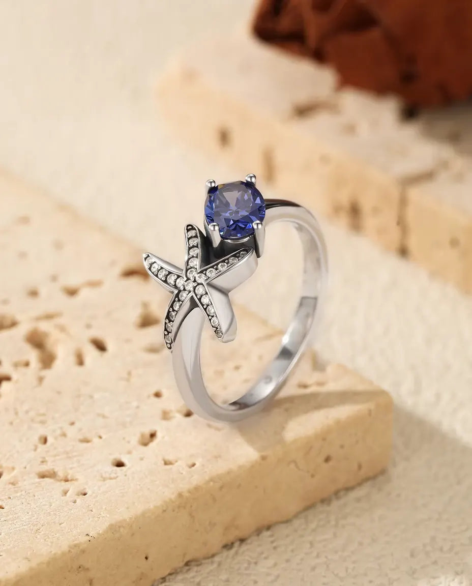 Anillo Estrella de Mar - circonita violeta ovalada de 5 x 7 mm y estrella en pavé, tallas 5 a 9, plata de ley 925