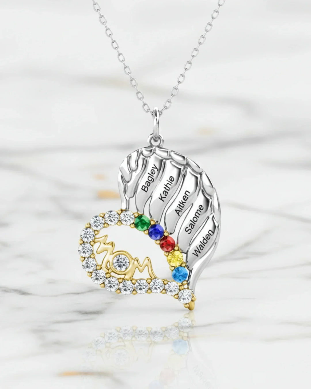 Collar con nombre para mamá – corazón alado de plata de ley 925 con MOM en pavé, de 3 a 6 nombres y sus piedras