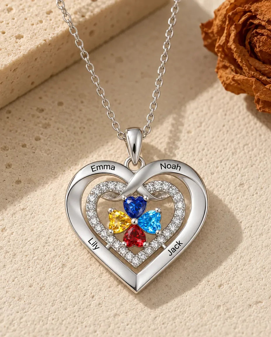 Collar de corazón con nombres grabados en el contorno y piedras de nacimiento en el centro - vista frontal en plata
