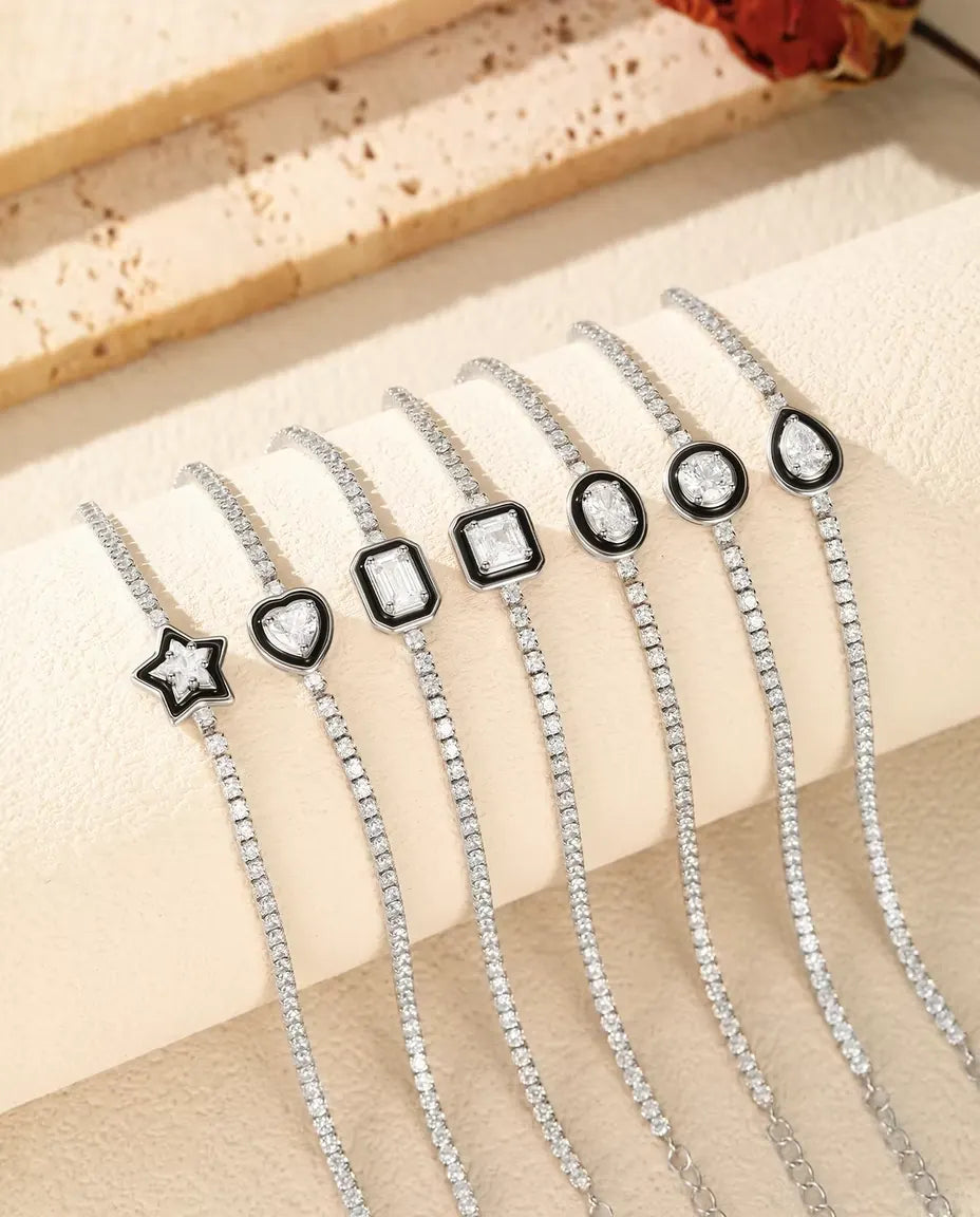 Pulsera Tenis en Plata 925 con Circonita Central de Marco Negro - las siete formas de piedra una junto a otra