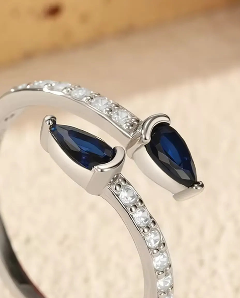 Anillo Abierto de Gotas Azules - dos piedras talla pera sobre aro de pavé abierto, plata 925, ajustable