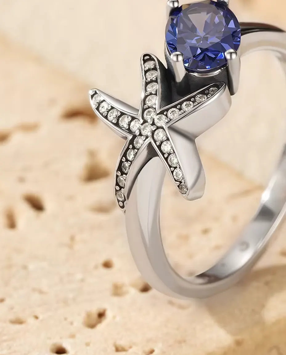 Anillo Estrella de Mar - circonita violeta ovalada de 5 x 7 mm y estrella en pavé, tallas 5 a 9, plata de ley 925
