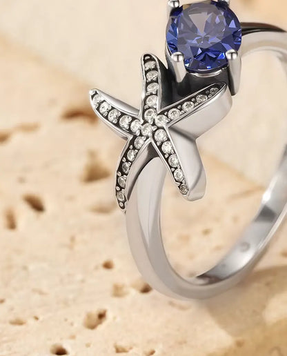 Anillo Estrella de Mar - circonita violeta ovalada de 5 x 7 mm y estrella en pavé, tallas 5 a 9, plata de ley 925