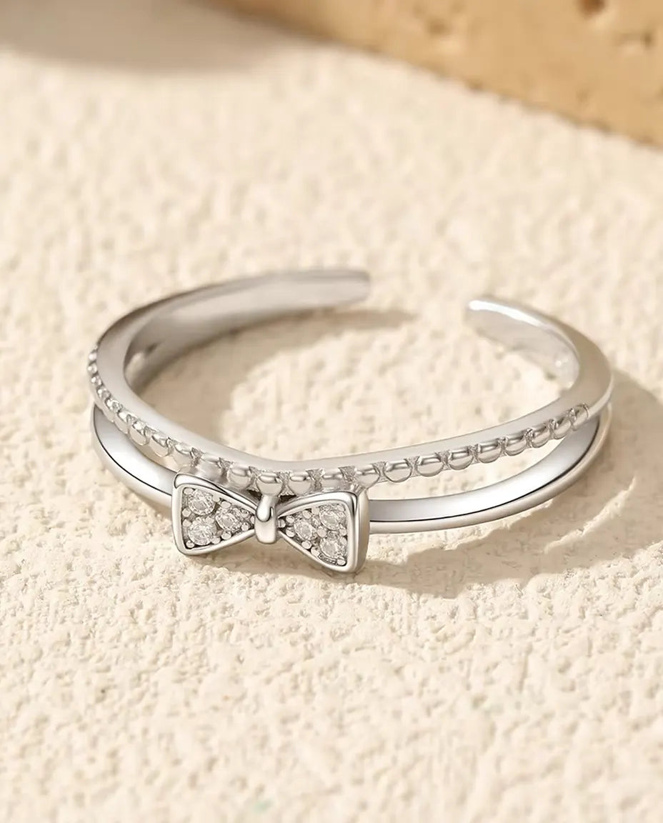 Anillo Lazo Circonita - lazo en pavé de 3,5 x 7 mm sobre banda doble con hilo de bolitas, ajustable, plata 925, US 6 a 9