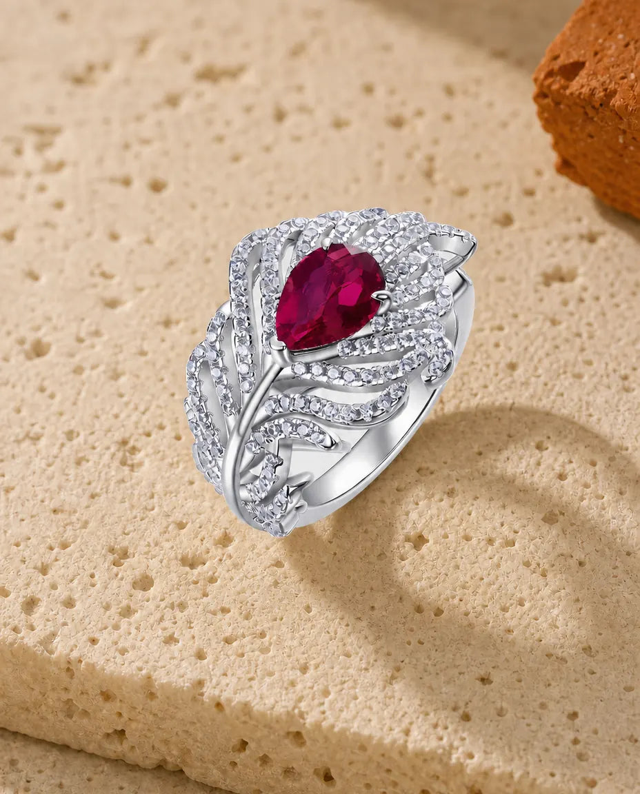 Anillo de rubí ovalado creado en laboratorio – alas de plumas en pavé, aro ajustable de plata de ley 925
