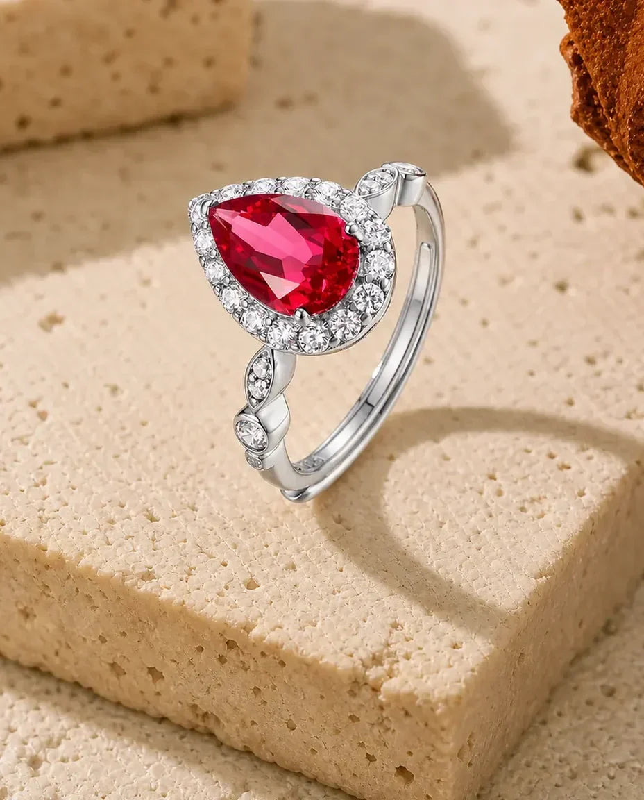 Anillo de rubí talla pera – engaste este-oeste con halo de circonitas, plata de ley 925 ajustable