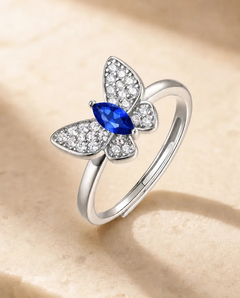 Anillo de zafiro creado en laboratorio – mariposa de circonitas con zafiro talla marquesa, plata de ley 925