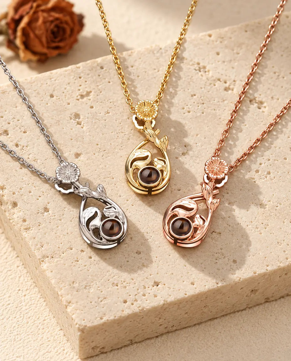 Colgantes de gota en plateado, dorado y color oro rosa con una margarita en la anilla