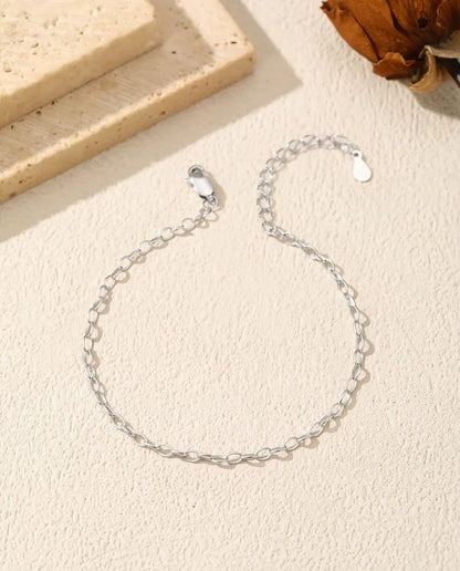 Pulsera Cadena Forzada en Plata 925 - suelta sobre una superficie clara, con cierre y alargador