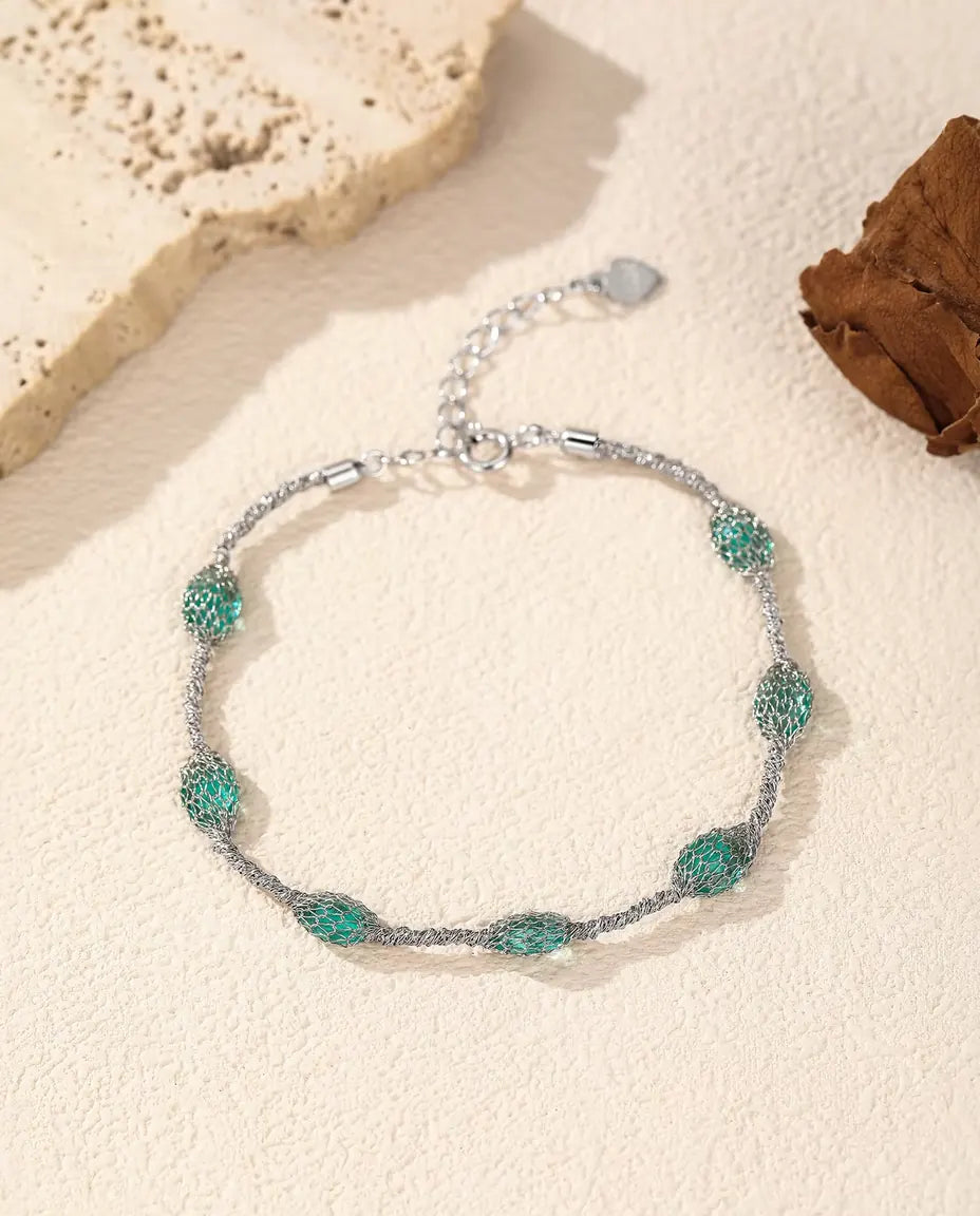 Pulsera de Circonitas en Jaula en Plata 925 - versión con circonitas verdes, más cerca de la malla de plata