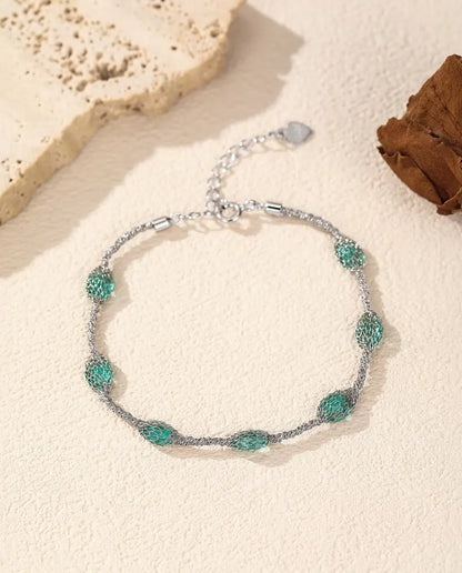 Pulsera de Circonitas en Jaula en Plata 925 - versión con circonitas verdes, más cerca de la malla de plata