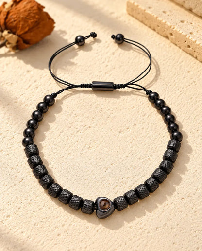 Pulsera unisex negra con corazón, cuentas cilíndricas con relieve y cuentas redondas