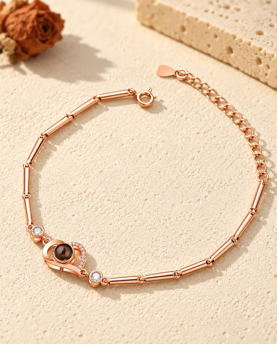 Pulsera de corazón abierto color oro rosa con foto dentro, cadena de barritas y extensión