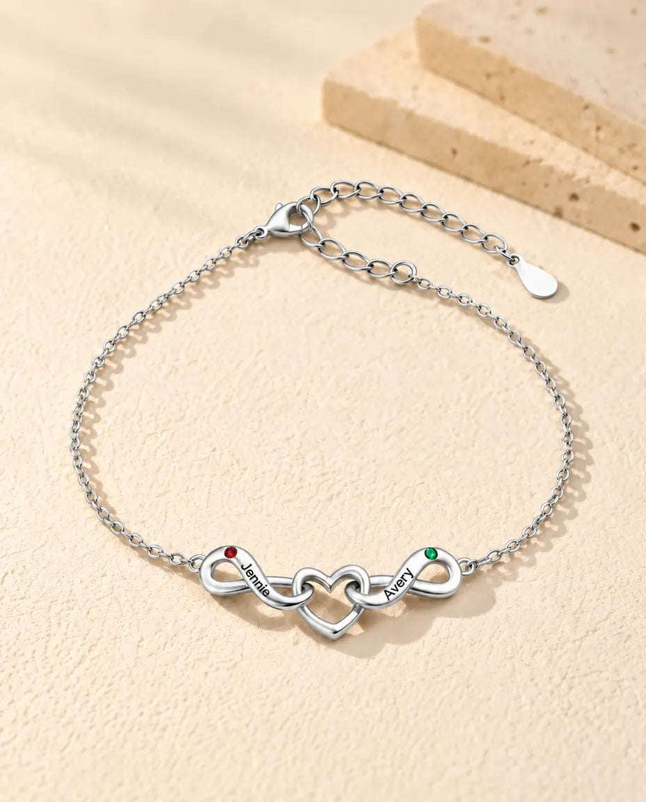 Pulsera Infinito Personalizada 2 Nombres - dos lazos infinitos en torno a un corazón y dos piedras de nacimiento - vista frontal