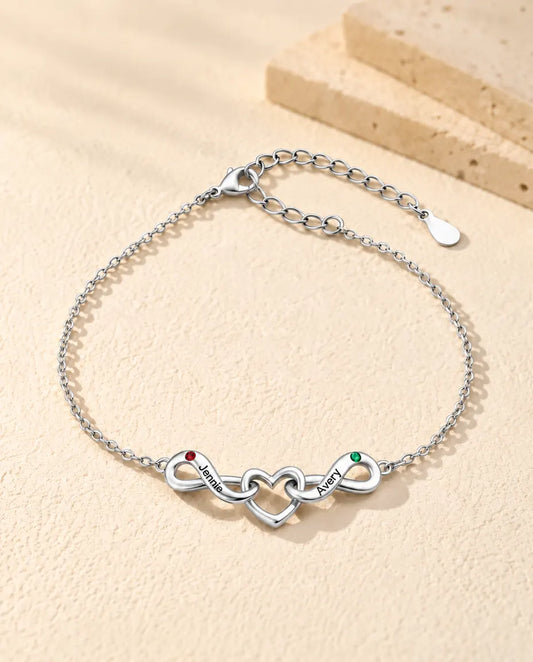 Pulsera Infinito Personalizada 2 Nombres - dos lazos infinitos en torno a un corazón y dos piedras de nacimiento - vista frontal